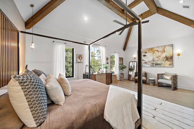 bedroom with high vaulted ceiling, beam ceiling, and light hardwood / wood-style flooring