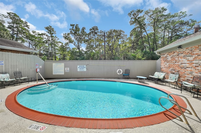 view of pool featuring a patio area