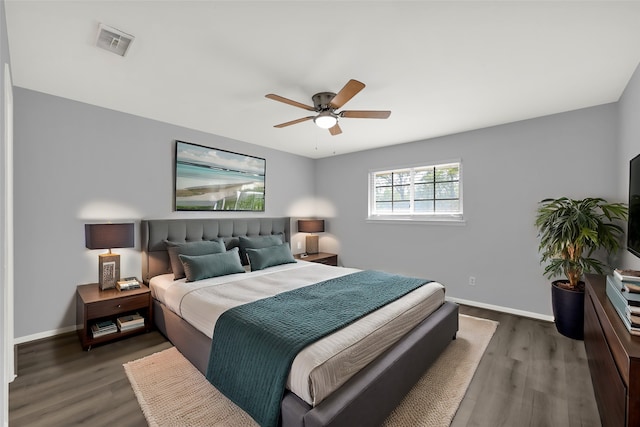 bedroom with dark wood-type flooring and ceiling fan