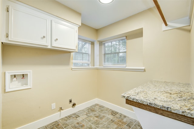 laundry room featuring cabinets, hookup for a gas dryer, hookup for a washing machine, and hookup for an electric dryer