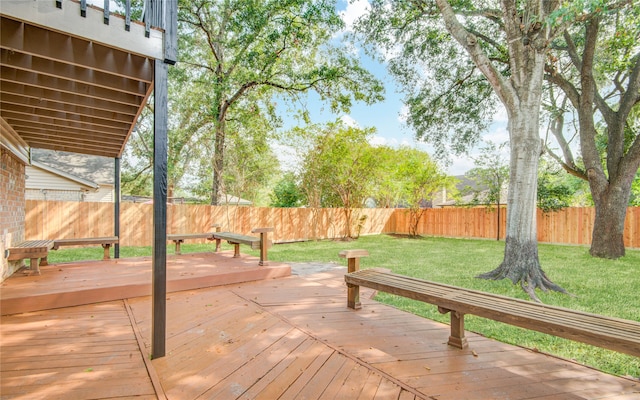 wooden terrace with a lawn