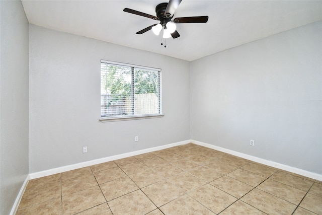 unfurnished room with light tile patterned flooring and ceiling fan