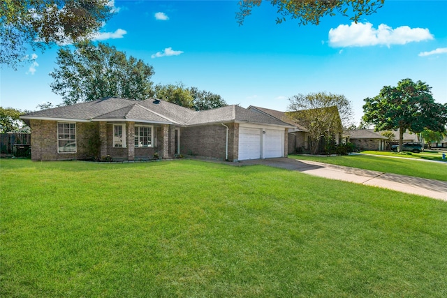 ranch-style home with a garage and a front lawn