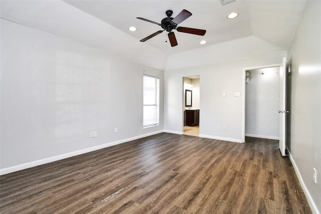 interior space with ensuite bathroom, dark hardwood / wood-style floors, and ceiling fan