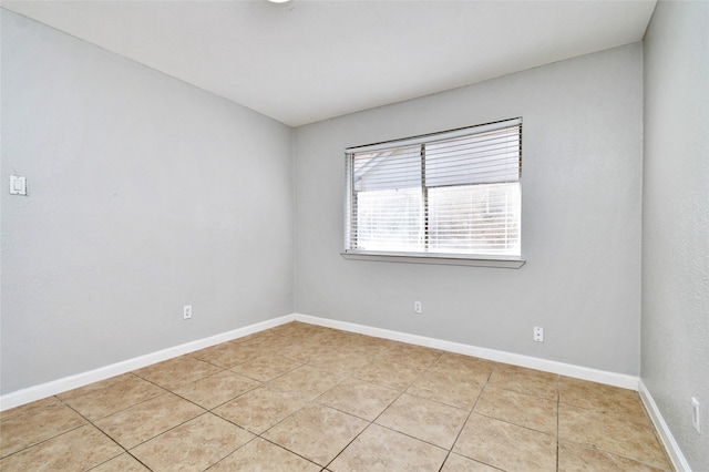 empty room with light tile patterned flooring