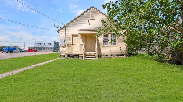 back of house with a yard