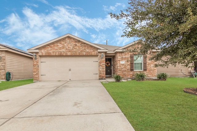 ranch-style house featuring a garage and a front lawn