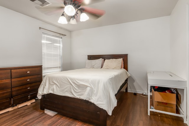 bedroom featuring dark wood-type flooring and ceiling fan