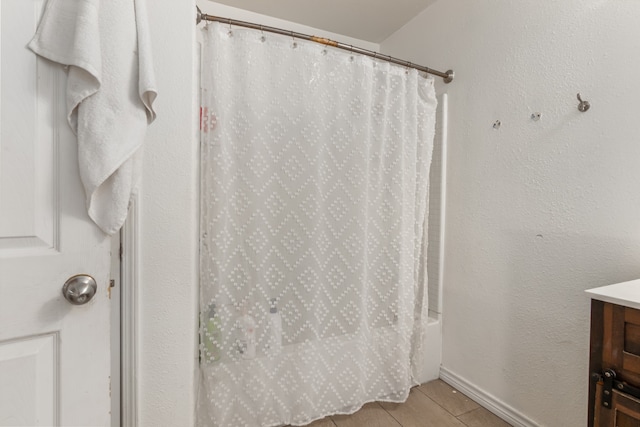 bathroom with shower / bath combo and vanity