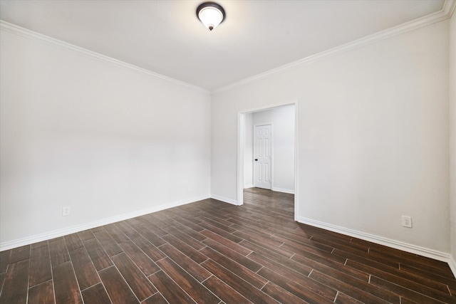 unfurnished room featuring ornamental molding and dark hardwood / wood-style floors