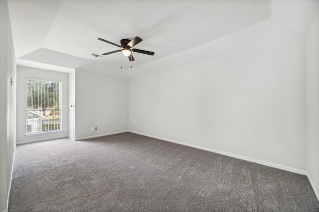 carpeted spare room featuring lofted ceiling and ceiling fan