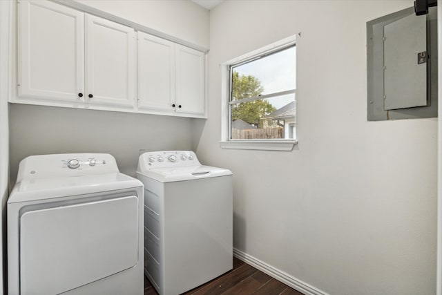 laundry room featuring electric panel, cabinets, washing machine and clothes dryer, and dark hardwood / wood-style floors