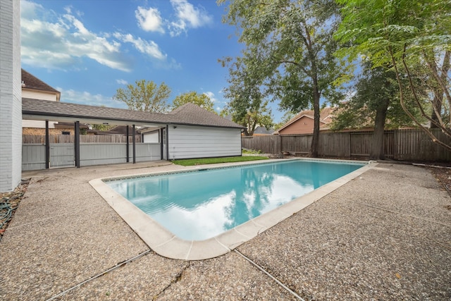 view of swimming pool with a patio