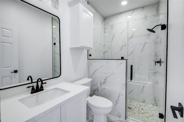 bathroom featuring walk in shower, vanity, and toilet