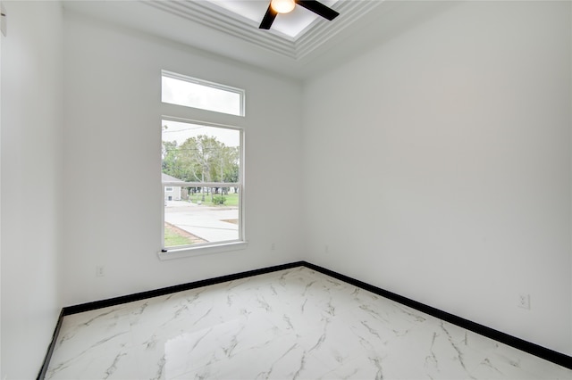 empty room featuring a wealth of natural light and ceiling fan