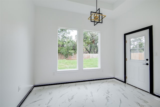 interior space featuring a chandelier and plenty of natural light