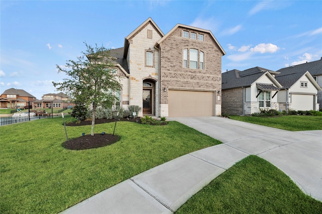 view of front of home featuring a garage and a front yard