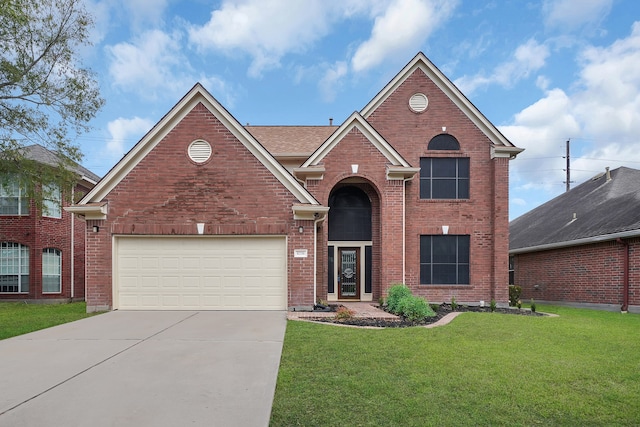 view of front property featuring a front yard and a garage