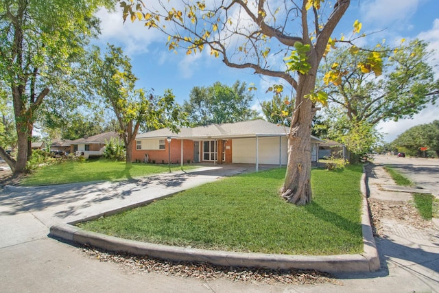 single story home with a garage and a front lawn