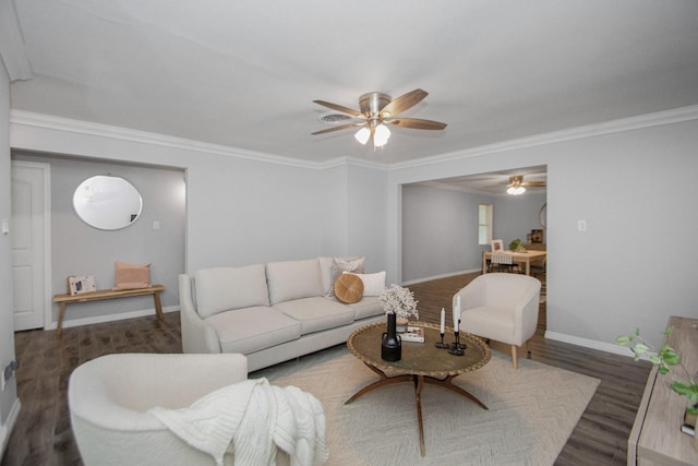 living room with crown molding and dark hardwood / wood-style flooring