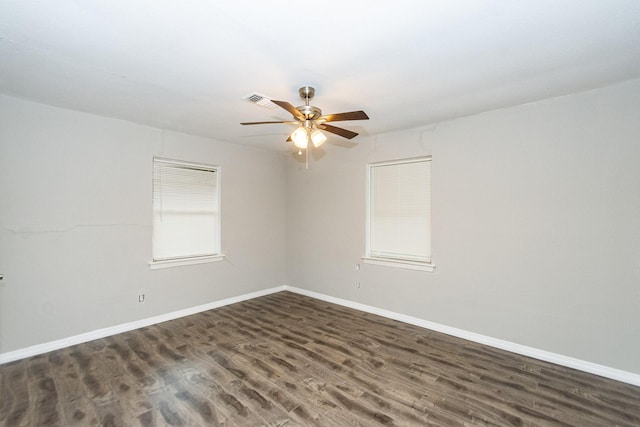 empty room with dark hardwood / wood-style floors