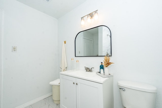 bathroom with vanity and toilet