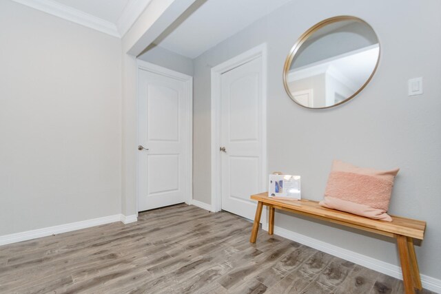 2002 Nottingham St, Pasadena, TX 77502 - entrance foyer with light wood-style floors, baseboards, and ornamental molding