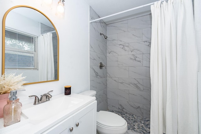 2002 Nottingham St, Pasadena, TX 77502 - bathroom featuring toilet, vanity, and a stall shower