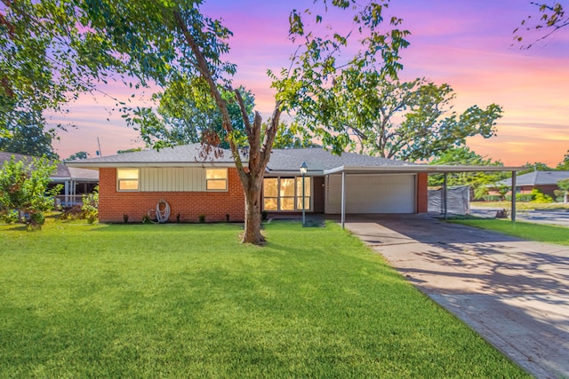 single story home with a lawn and a garage