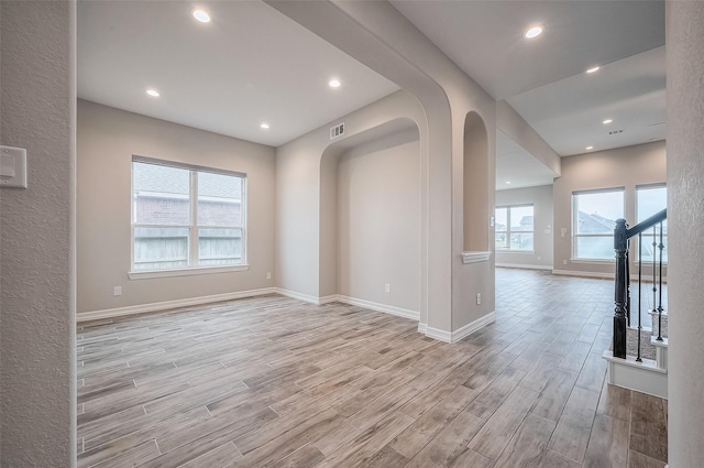 interior space with light hardwood / wood-style flooring and a wealth of natural light