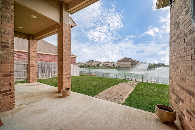 view of patio / terrace with a water view