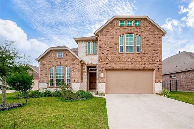 view of front property featuring a front lawn and a garage