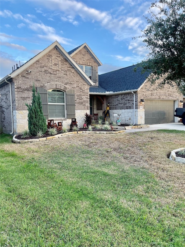 view of front property with a front yard and a garage