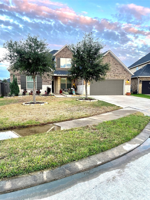 obstructed view of property with a garage and a lawn