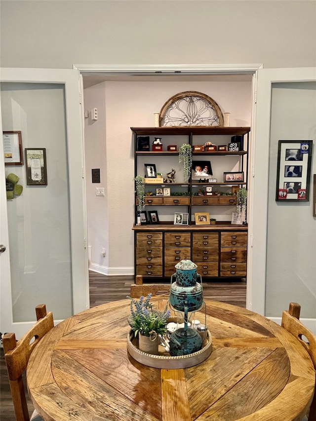 dining area with dark wood-type flooring