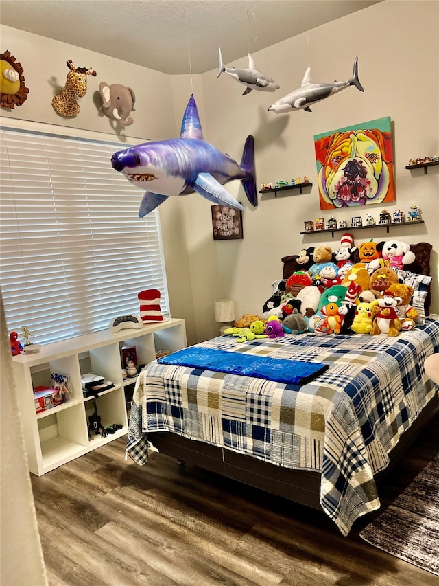 bedroom with hardwood / wood-style floors