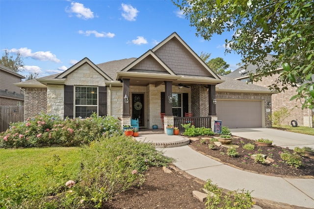 craftsman inspired home with a garage and a porch