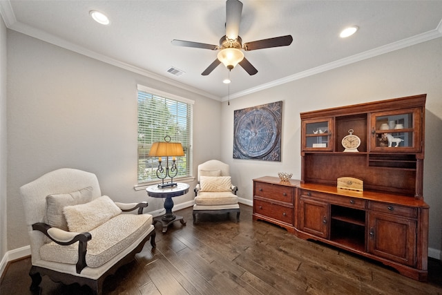 sitting room featuring dark hardwood / wood-style flooring, ceiling fan, and ornamental molding