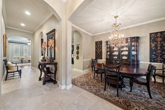 dining space with a notable chandelier and ornamental molding