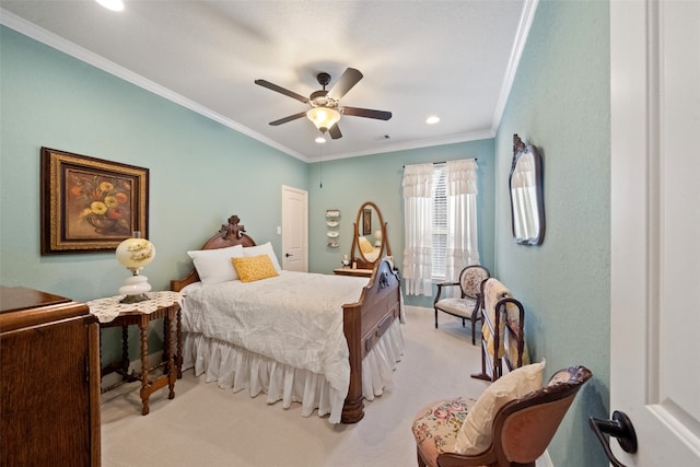 bedroom with ceiling fan, crown molding, and light colored carpet