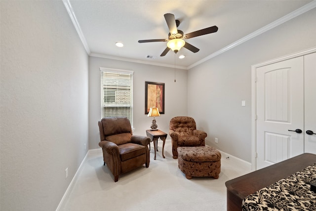 living area featuring ceiling fan, light colored carpet, and ornamental molding