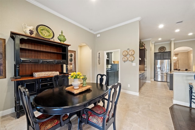 dining space featuring ornamental molding