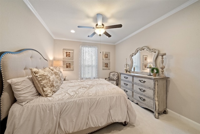 carpeted bedroom featuring ceiling fan and crown molding