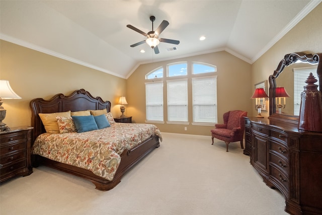 carpeted bedroom with ornamental molding, vaulted ceiling, and ceiling fan