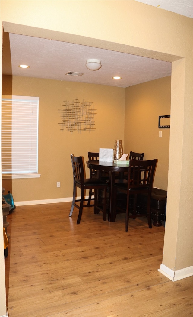 dining room with light hardwood / wood-style floors