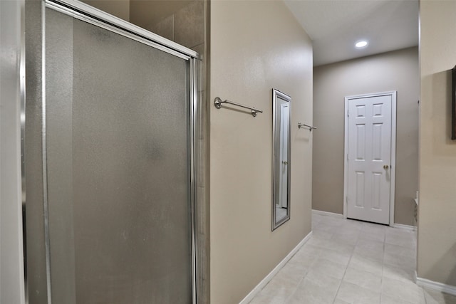 bathroom with tile patterned flooring and an enclosed shower