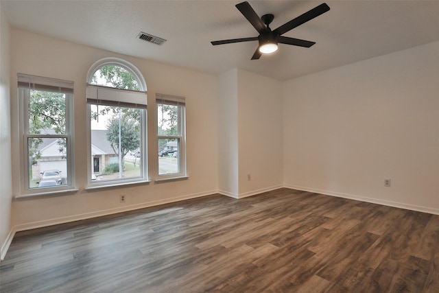 unfurnished room with ceiling fan and dark hardwood / wood-style floors