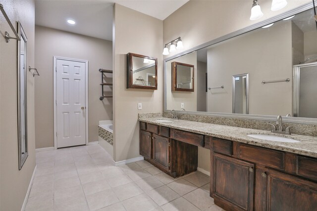 bathroom with tile patterned flooring, vanity, and plus walk in shower