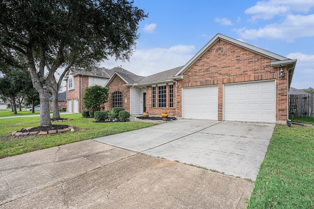 view of front facade with a front yard and a garage