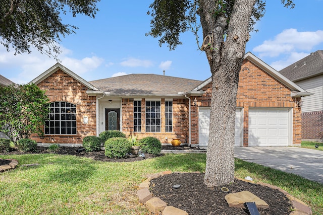 view of front of house with a garage and a front lawn